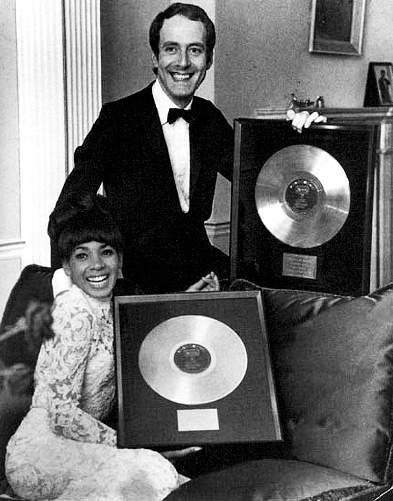 Shirley Bassey and John Barry show off their Gold records